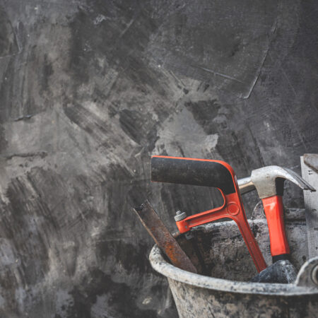 Construction tools placed on wooden floors.