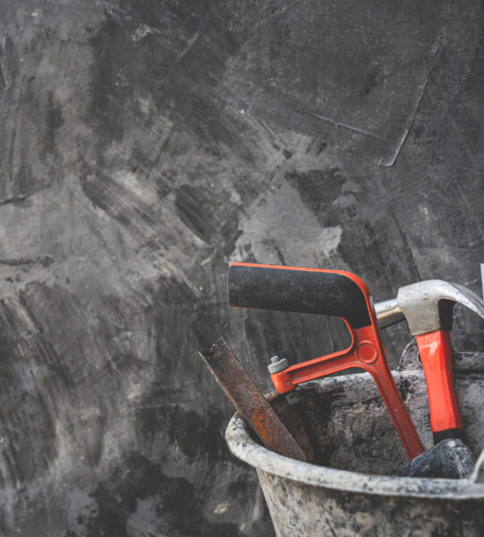Construction tools placed on wooden floors.